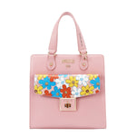 Our  pink Floral Pop Tote Bag set on a  white background