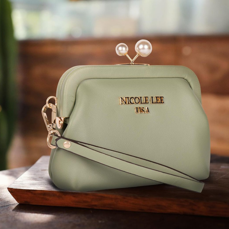 OUR NICOLE LEE  ELSIE PEARL COIN PURSE IN OUR SAGE DESIGN  SET IN A MODERN BACKGROUND