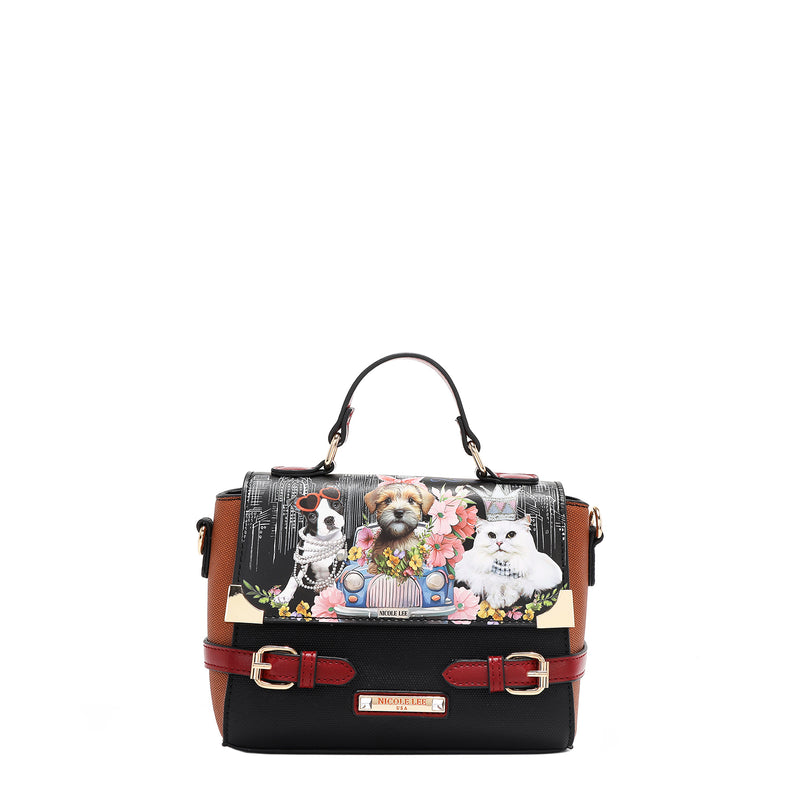 Nicole Lee Family Yearbook crossbody with top handle part of the Family Yearbook 3-in-1 set! A playful design that’s perfect for any occasion with a fun mix of dogs and cats stylishly dressed in flowers and pearls with a city scape line drawing background. Buckle strap details and side D-rings for optional crossbody strap attachment. 