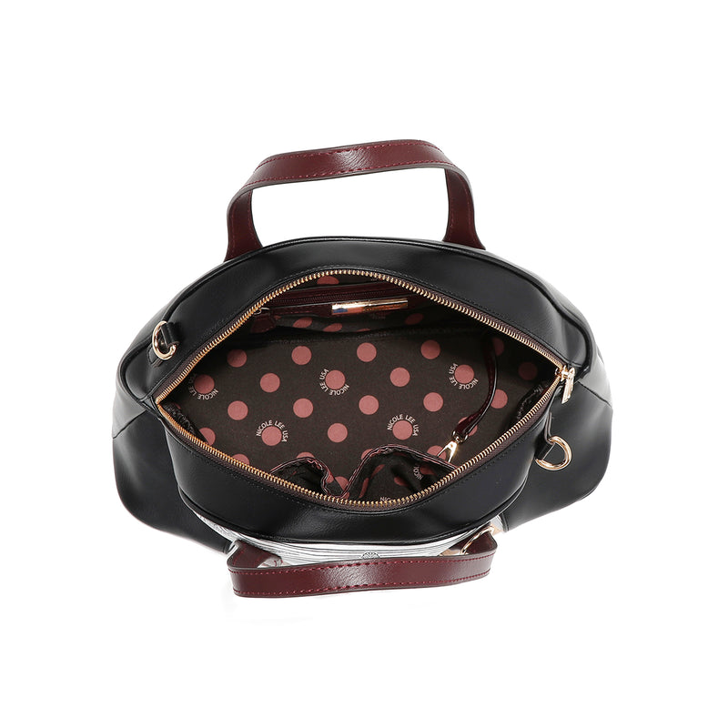Interior of vegan leather Ladies Night Out dome shaped handbag part of LADIES NIGHT OUT 3 PIECE SET (Handbag, Crossbody, Wallet). Dome shaped zip handbag with dual top handles and side D-rings for optional crossbody strap attachment. Polka dot interior lining in brown and pink with multiple interior pockets for storage and organization and key strap to attach keys.