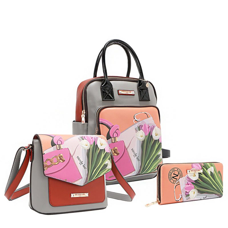 Front angle of the Nicole Lee vegan leather (VIOLET BLOSSOM 3 PIECE SET (Backpack, Crossbody, Wallet). This must-have set includes a spacious backpack, a chic flap crossbody, and a sleek zip wallet—each designed to nest perfectly inside the backpack. Wear them together or style them separately—the possibilities are endless.