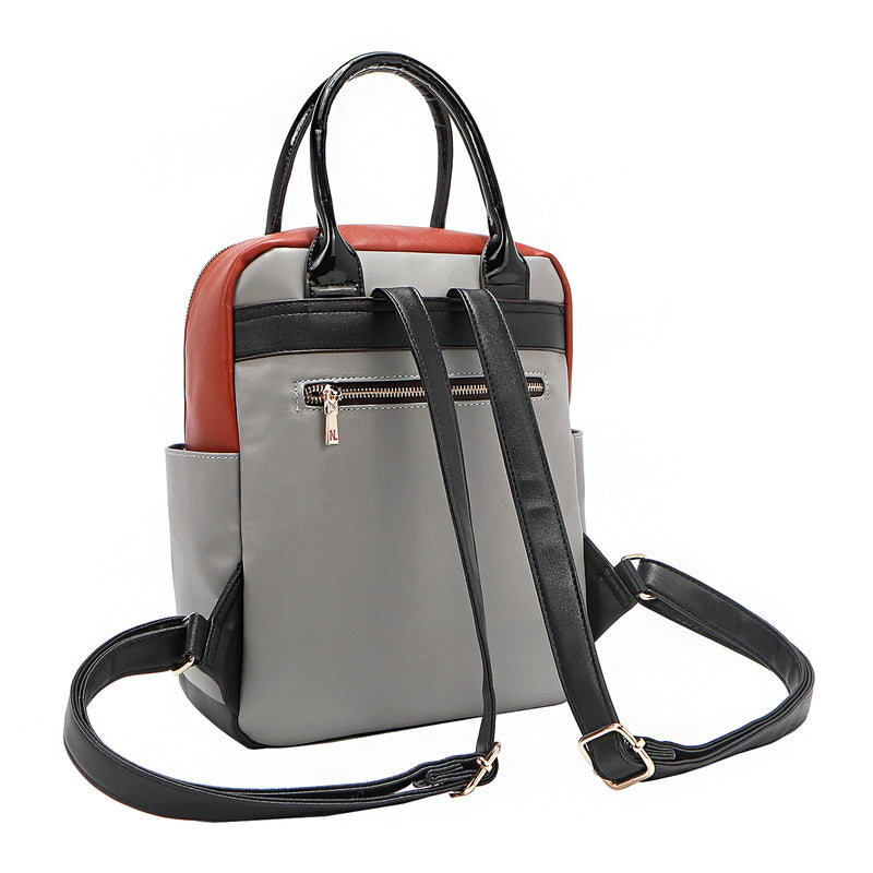 Back angle of the Nicole Lee vegan leather Violet Blossoms backpack, part of the VIOLET BLOSSOM 3 PIECE SET (Backpack, Crossbody, Wallet). Glossy patent leather dual top handles and dual shoulder straps for varied carrying options. Additional back zip pocket with bow zipper puller for easy and secure access to your most-used essentials. 