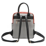 Back of the Nicole Lee vegan leather Violet Blossoms backpack, part of the VIOLET BLOSSOM 3 PIECE SET (Backpack, Crossbody, Wallet). Glossy patent leather dual top handles and dual shoulder straps for varied carrying options. Additional back zip pocket with bow zipper puller for easy and secure access to your most-used essentials. 