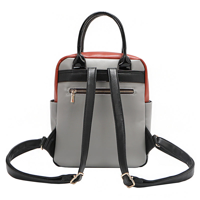 Back of the Nicole Lee vegan leather Violet Blossoms backpack, part of the VIOLET BLOSSOM 3 PIECE SET (Backpack, Crossbody, Wallet). Glossy patent leather dual top handles and dual shoulder straps for varied carrying options. Additional back zip pocket with bow zipper puller for easy and secure access to your most-used essentials. 