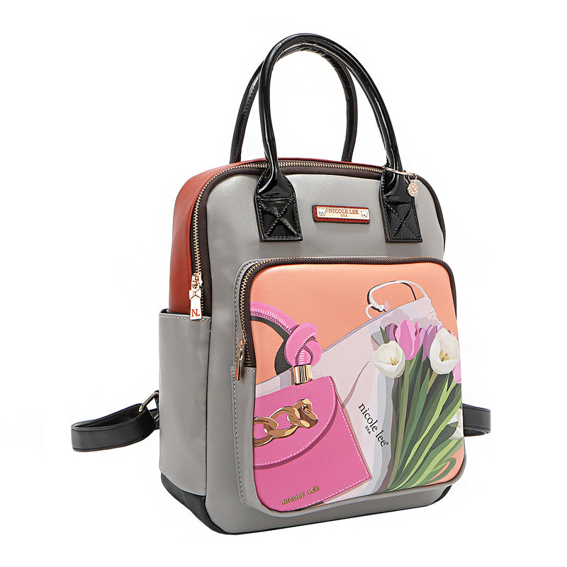 Front angle of the Nicole Lee vegan leather Violet Blossoms backpack, part of the VIOLET BLOSSOM 3 PIECE SET (Backpack, Crossbody, Wallet). Illustration of pink and white tulips against a Nicole Lee branded dust bag and hot pink structured chain link bag. Dual top handles and dual shoulder straps with logo-engraved gold-tone nameplate with diamond rhinestones. Main zip top closure with side slip pockets and additional front zip compartment. 