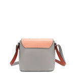 Back of the Nicole Lee vegan leather Violet Blossoms flap crossbody, part of the 3-in-1 Violet Blossoms travel-friendly backpack, handbag, and wallet set. Solid light gray back with light coral and deep orange accents. 
