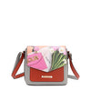 Nicole Lee vegan leather Violet Blossoms flap crossbody, part of the VIOLET BLOSSOM 3 PIECE SET (Backpack, Crossbody, Wallet). Illustration of pink and white tulips against a Nicole Lee branded dust bag and hot pink structured chain link bag. Adjustable shoulder strap and logo-engraved gold-tone nameplate with diamond rhinestones. 
