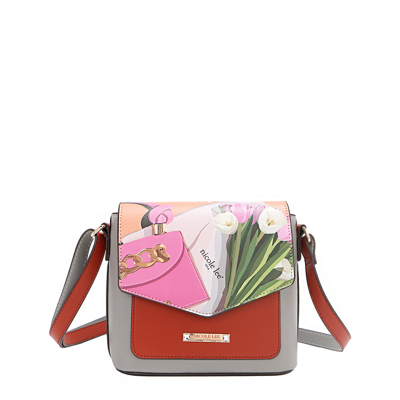 Nicole Lee vegan leather Violet Blossoms flap crossbody, part of the VIOLET BLOSSOM 3 PIECE SET (Backpack, Crossbody, Wallet). Illustration of pink and white tulips against a Nicole Lee branded dust bag and hot pink structured chain link bag. Adjustable shoulder strap and logo-engraved gold-tone nameplate with diamond rhinestones. 