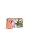Front angle of the Nicole Lee vegan leather Violet Blossoms zip wallet, part of the VIOLET BLOSSOM 3 PIECE SET (Backpack, Crossbody, Wallet). Illustration of pink and white tulips against a Nicole Lee branded dust bag and hot pink structured chain link bag. Logo-engraved gold-tone nameplate with diamond rhinestones. Main zip closure. 