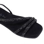 A CLOSER LOOK ON OUR DANI SANDAL. RHINESTONE ENCRUSTED CRISSCROSS STRAPS AND A MODERN SQUARE TOE.