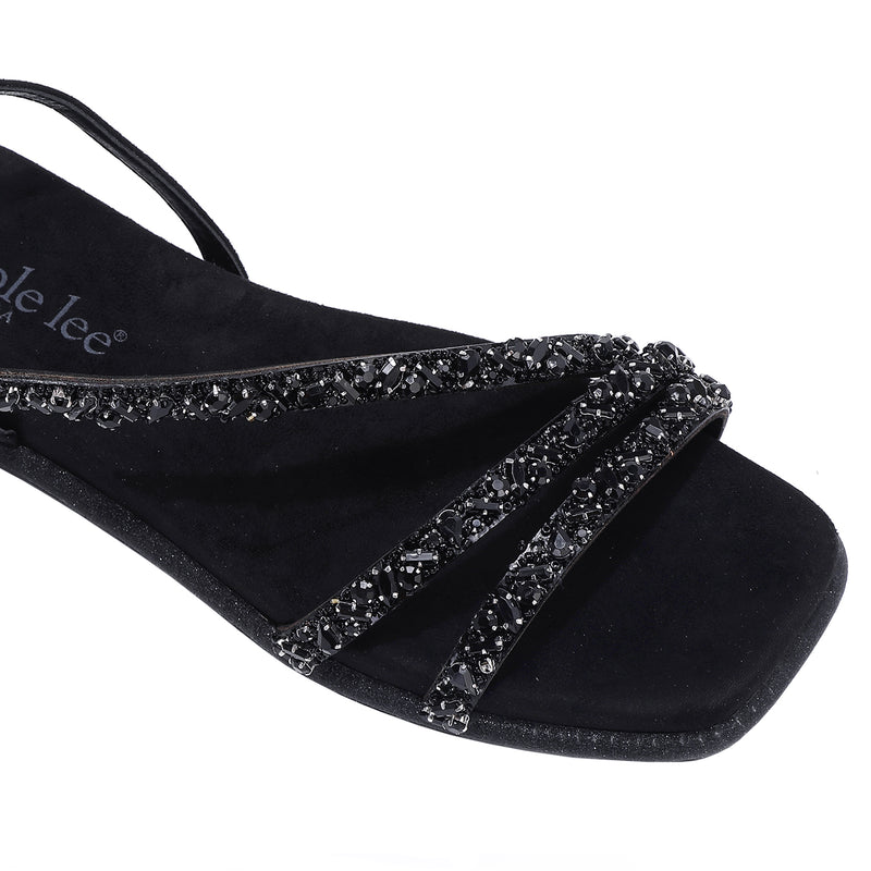 A CLOSER LOOK ON OUR DANI SANDAL. RHINESTONE ENCRUSTED CRISSCROSS STRAPS AND A MODERN SQUARE TOE.