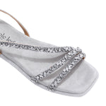 A CLOSER LOOK ON OUR DANI SANDAL. RHINESTONE ENCRUSTED CRISSCROSS STRAPS AND A MODERN SQUARE TOE.