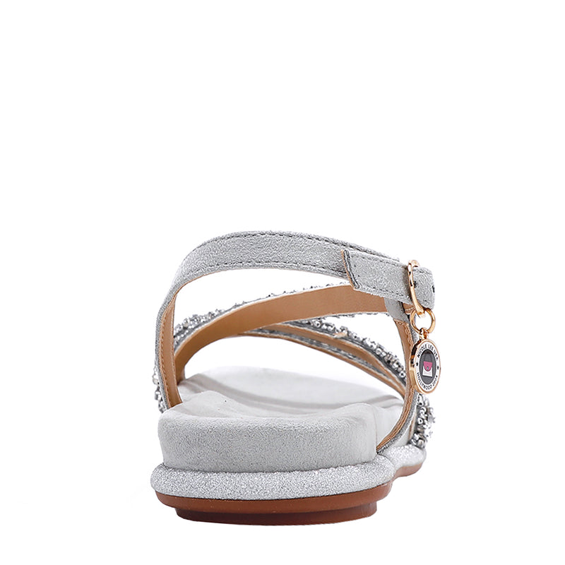 OUR DANI RHINESTONE SANDAL IN SILVER EMBELLISHED WITH A ADJUSTABLE BUCKLE CLOSURE. SUEDE UPPER AND INSOLE. OPEN TOE AND RUBBER OUTSOLE