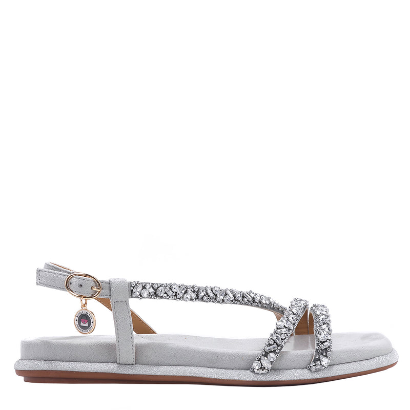 OUR DANI RHINESTONE SANDAL IN SILVER EMBELLISHED WITH A ADJUSTABLE BUCKLE CLOSURE WITH A NICOLE LEE CHARM FOR STATEMENT. SUEDE UPPER AND INSOLE. OPEN TOE AND RUBBER OUTSOLE