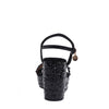 The platform  wedge is adorned with black rhinestones and  braid detailing.