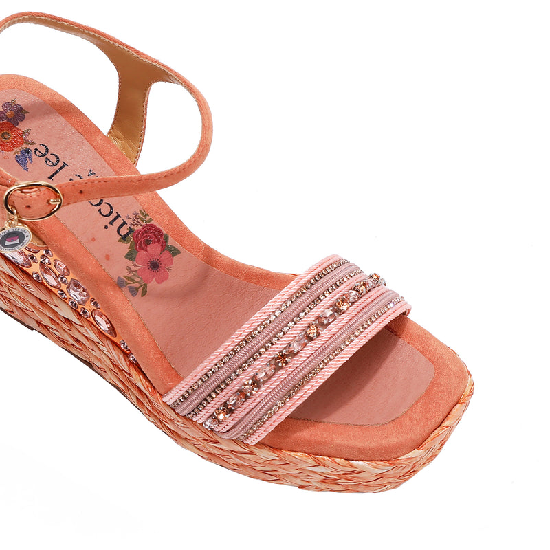 Kali Espadrille Wedge sandal in pink.  Fitted with 1 adjustable buckle. .The insole is pink with the Nicole Lee logo. Top strap is embellished with rhinestones.
