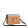 Our Sun and Sand Crossbody bag with palm tree design on an orange background with straps