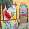 Our Sun and Sand Tropical-themed door with 'Life is Better at the Beach' sign, watermelon, pineapple, and deck chair.