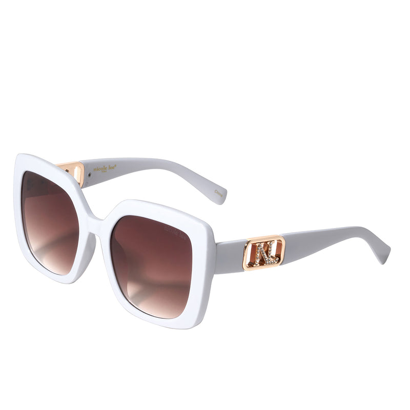 OUR NICOLE LEE SQUARED SUNGLASSES IN WHITE WITH A DIAMOND ENCRUSTED NL LOGO.
