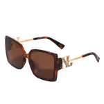 OUR LEOPARD SQUARE SUNGLASSES. NICOLE LEE RHINESTONE LOGO ON THE SIDES OF THE FRAMES.