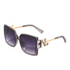 OUR SMOKE SILVER SQUARE SUNGLASSES. NICOLE LEE RHINESTONE LOGO ON THE SIDES OF THE FRAMES.